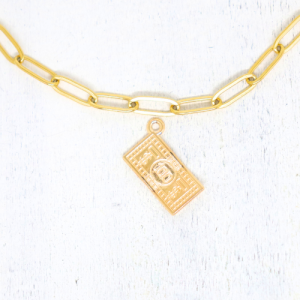 100 dolláros aranyszínű charm